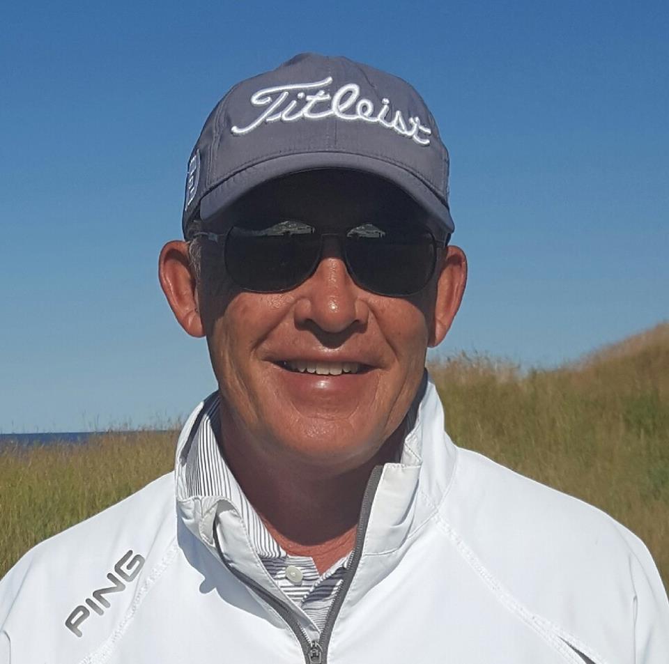 Don Du Chateau giving a golf lesson