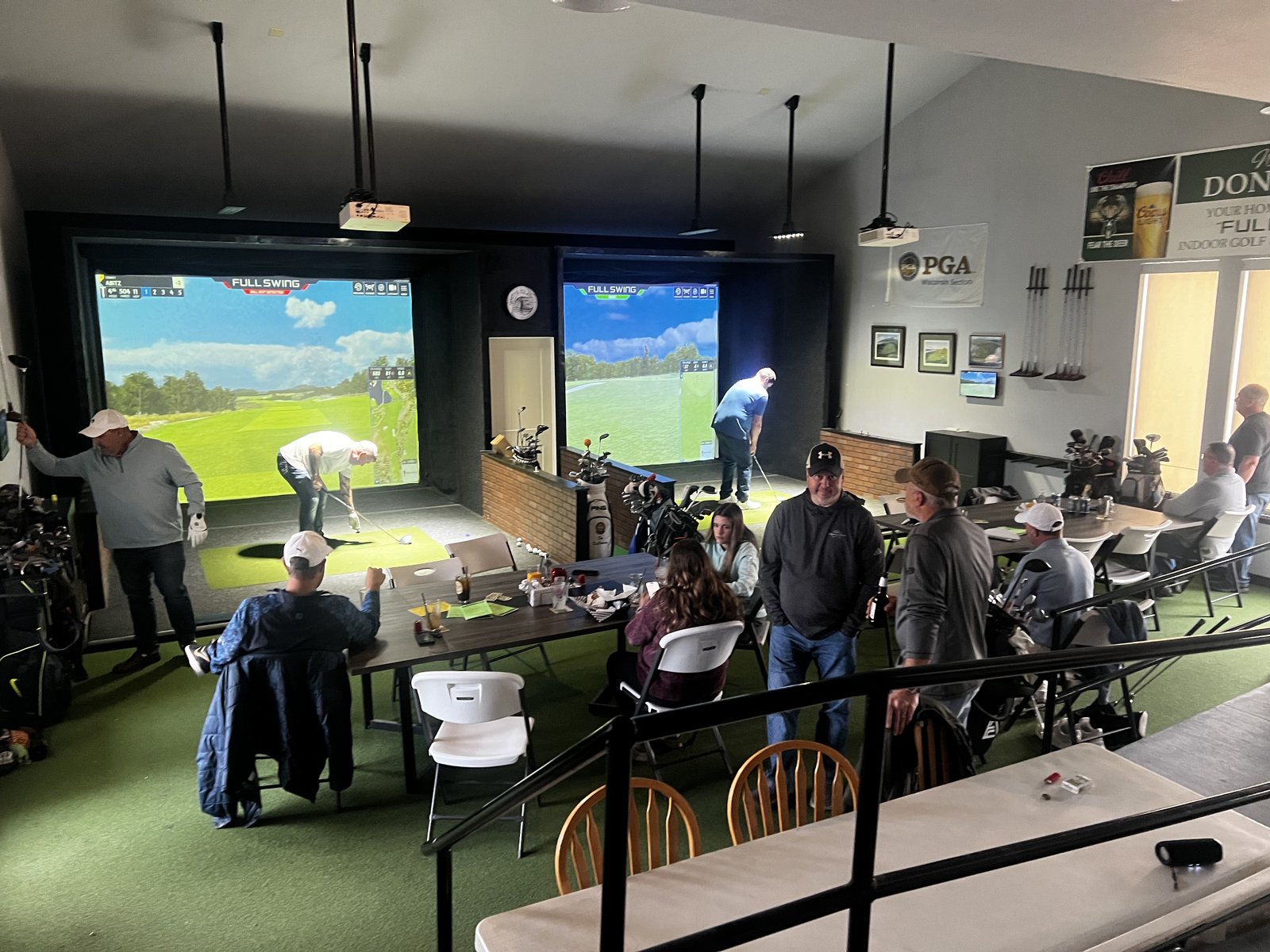 Donny Du's interior with Full Swing simulators in use